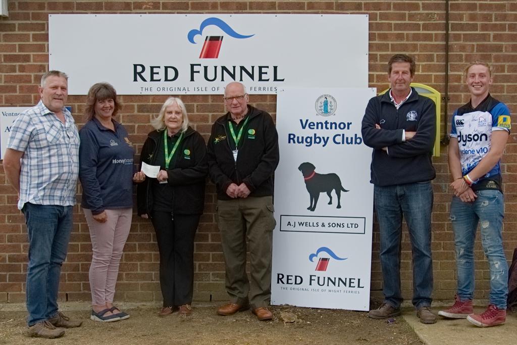 Ventnor RFC cheque presentation to Hampshire & IOW Air Ambulance 10/06/2019 following Isle of Wight RAndonnee 2019: L to R: Steve MACEY (VP), Kay ENGELGARDT (VP), Pat and Albie KNIGHT (Hampshire & IOW Air Ambulance, Roly TOOMBS (Clubhouse Manager), Chris HILL (player and Bar Manager): Photo credit: Ventnor RFC Magazine