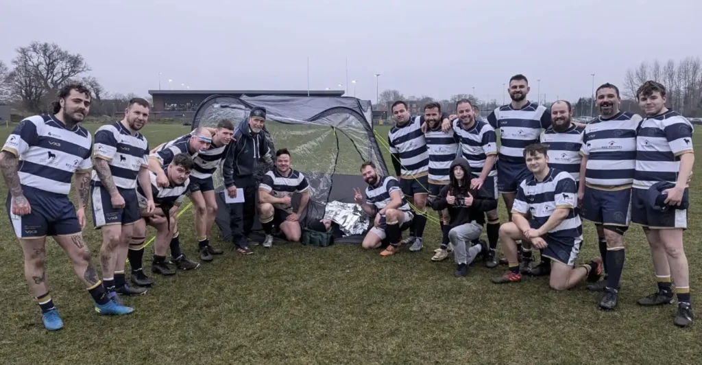 Ventnor’s 1st XV gather round their injured colleague Andy Teague Romsey 180125